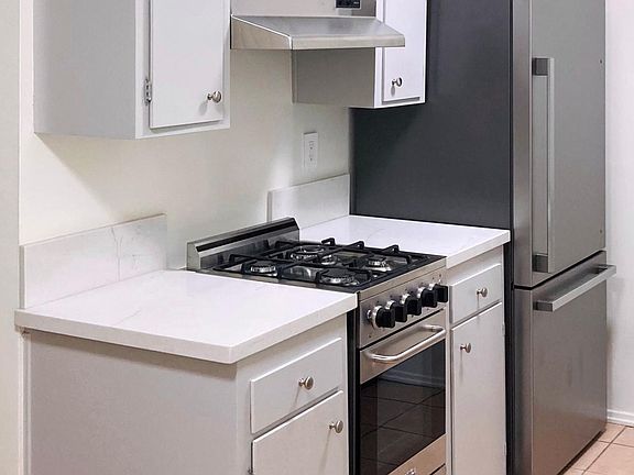 Kitchen, stove fridge view.