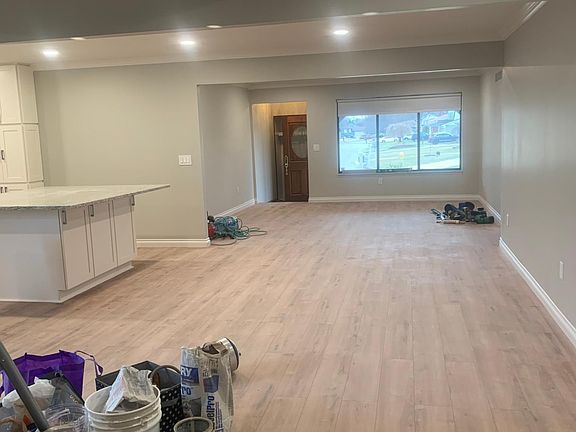Looking from family room to front window and doot
