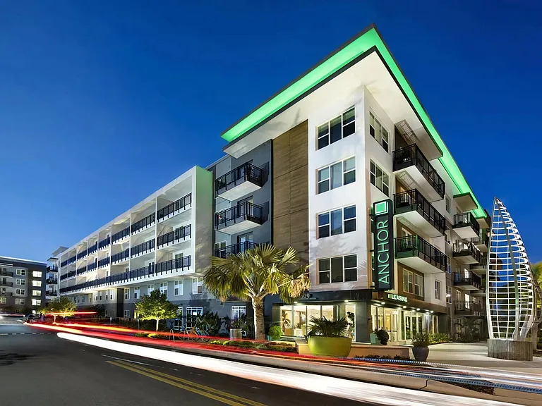 Anchor Riverwalk Entrance Featuring Illuminated Sculpture and Modern Leasing Center with Sign