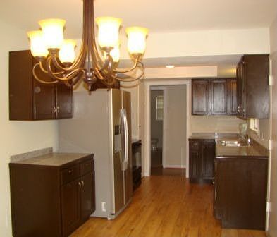 Brand new kitchen with granite counter, stainless steel appliances
