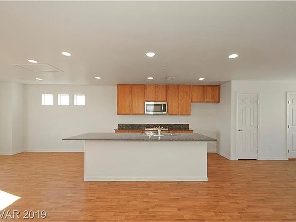 Great prep area on this large kitchen island with overhang for counter dining.