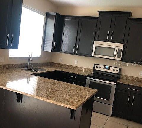 4th image of 9465 Tawnyberry St