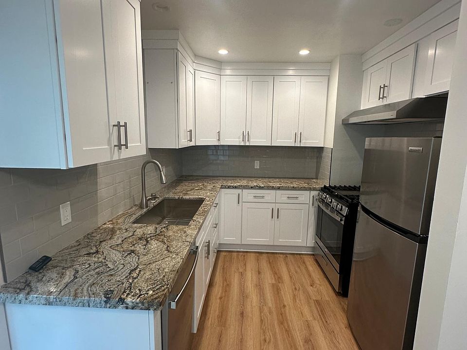 Brand new Kitchen with granite counters, farmhouse sink and stainless appliances