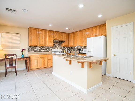 5th image of 9736 W Tompkins Ave