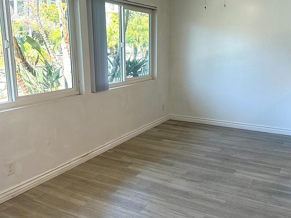 Dining area is spacious and can accommodate any size table with large windows and ceiling fan and opens onto gourmet kitchen