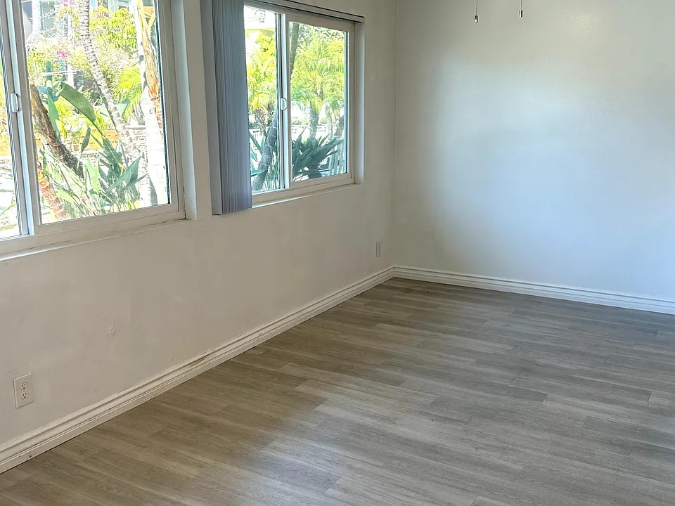 Dining area is spacious and can accommodate any size table with large windows and ceiling fan and opens onto gourmet kitchen