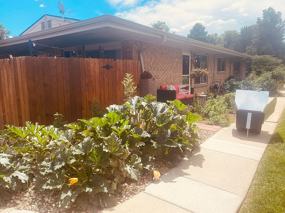 Lovely outdoor spaces: fenced private patio, stone front patio, garden boxes, native plantings
