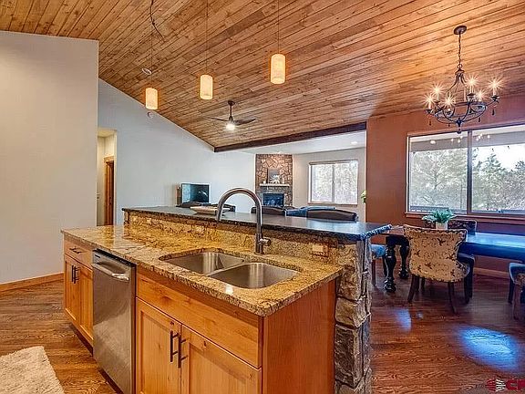 Open kitchen and bar with views to the deck