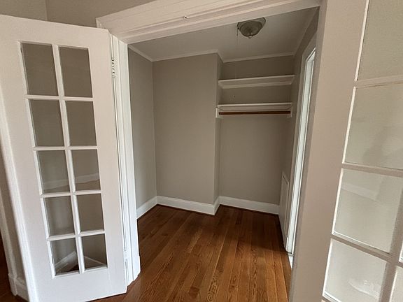 closet off of living room that leads to bathroom 1
