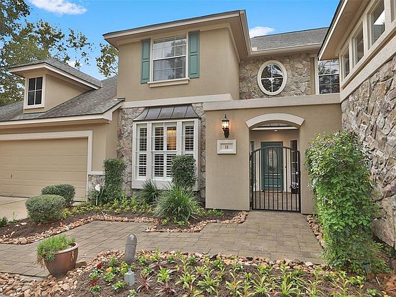 The entrance to the residence is gated and can be locked for privacy. The triple-wide drive will hold your vehicles and those of your guests. Beyond the wrought iron gated entry is the welcoming front door and a private courtyard.