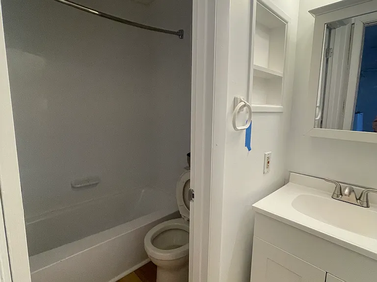 Tub and Shower to the left of sink