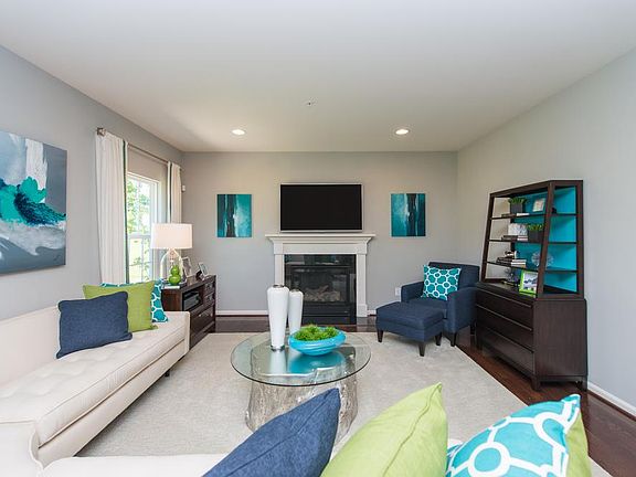 Family Room has hardwood floors and gas fireplace as shown. This picture is of a like home, working on getting pictures taken of this home.