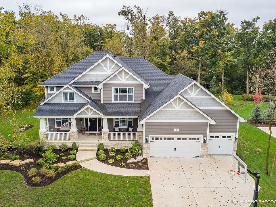 Enjoy a professionally landscaped exterior with a massive three car garage.