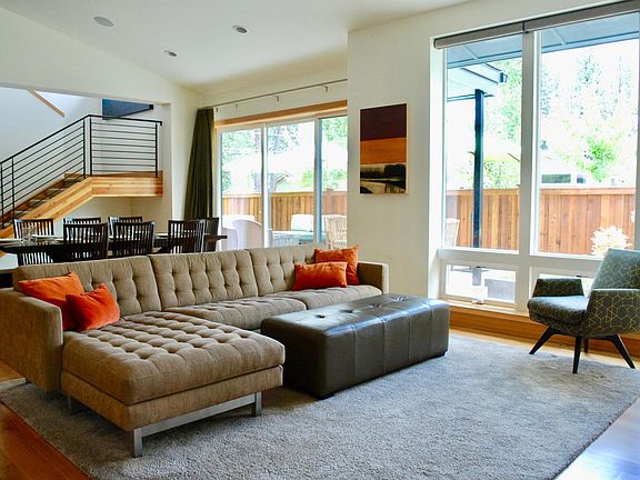 Main floor living / dining area with slider opening out to p