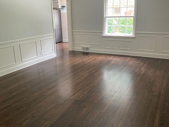 large front living area with original wainscoting