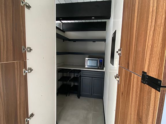 Hidden walk-in pantry.