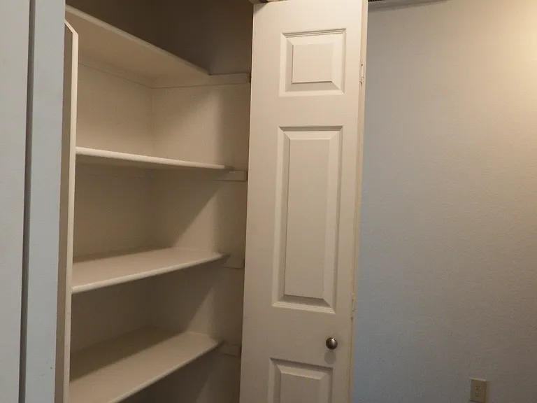 Entry coat closet storage