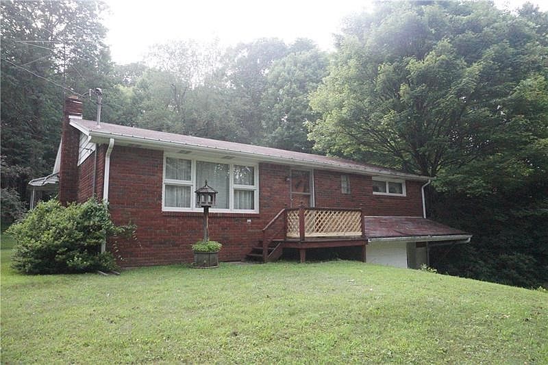 Front view of home taken from front yard.  Front door brings you into the living area.