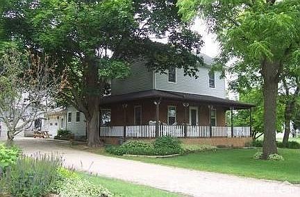 East and South view of house : Enter porch on West and East side. Enter house on South from porch.