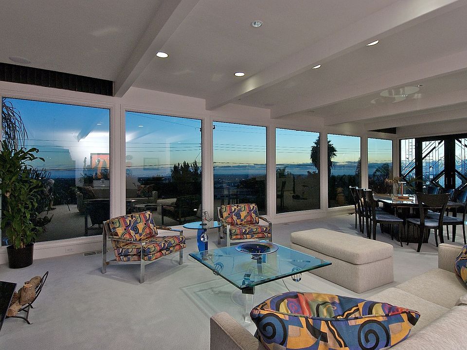 Living Room w/ fireplace and built-in entertainment center.