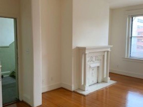 Front entrance to apartment showing foyer and living room