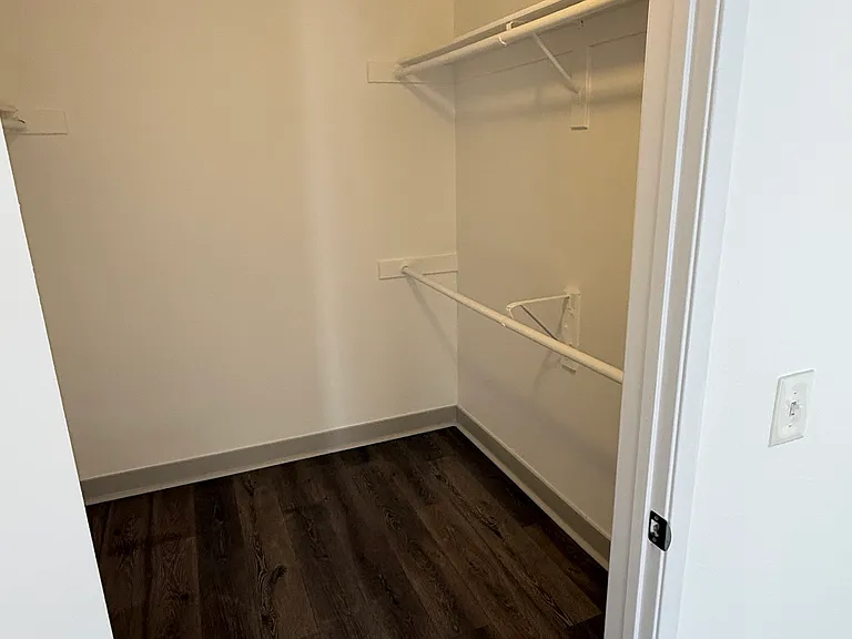 large walk in closet in bedroom