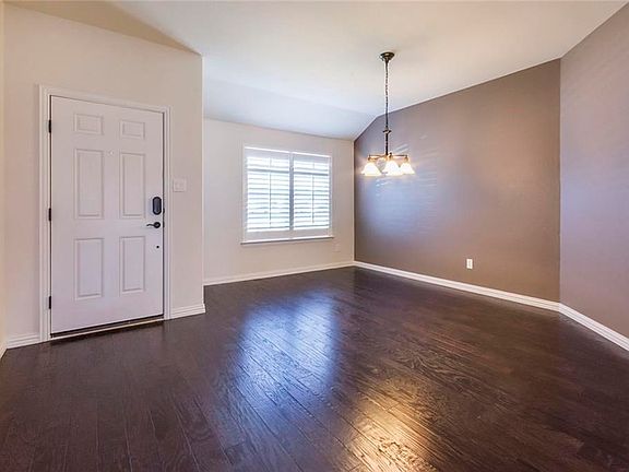 Convenient keyless entry and large Formal Dining Room with Hardwood Floors, Plantation Shutters and Designer Paint