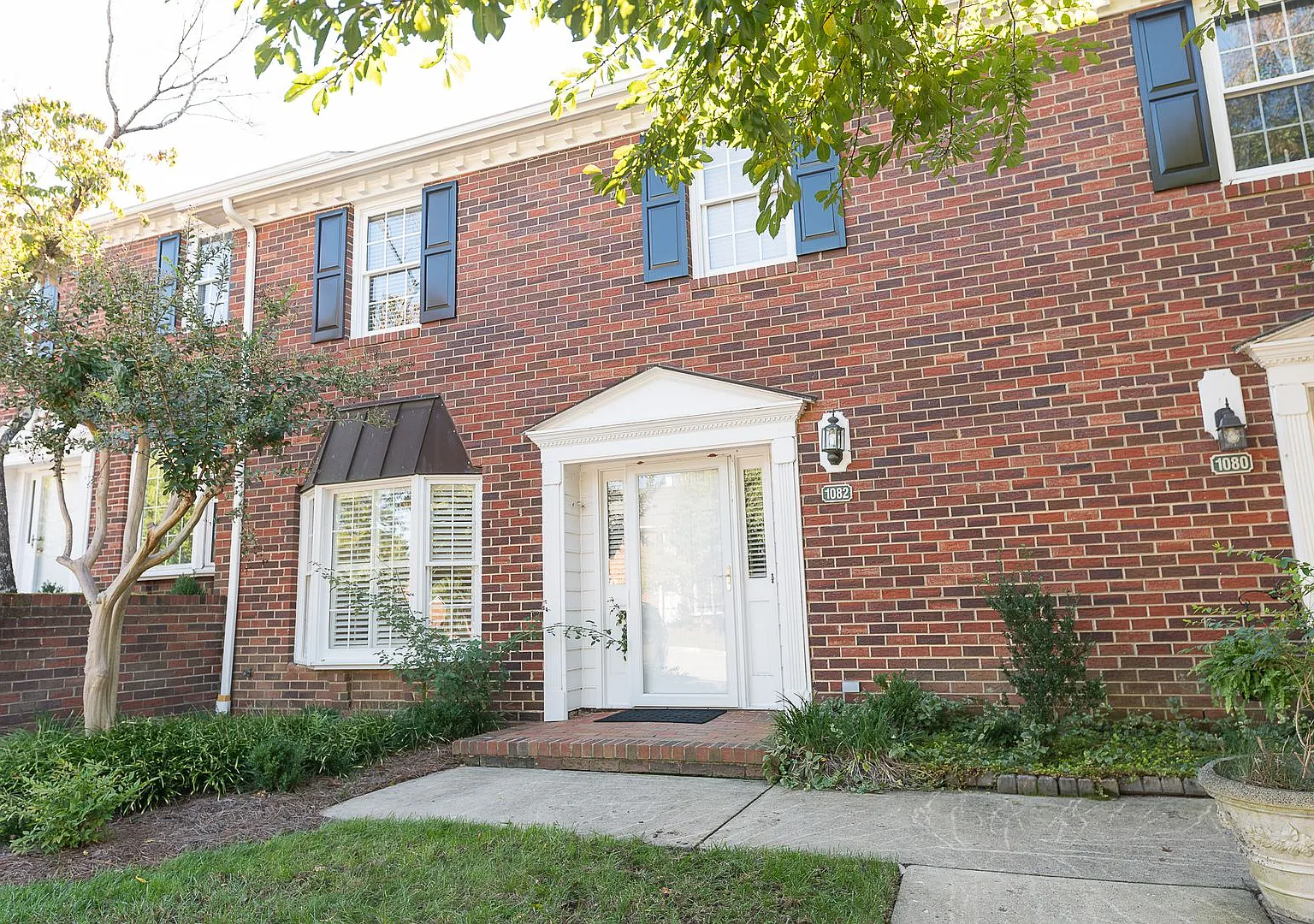 Charming 3BR Townhome with Sunroom, Pool & Tennis Courts — Photo 1