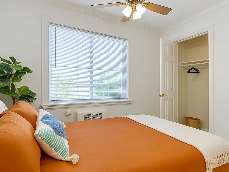 Bright and cozy bedroom with a queen bed and a spacious closet_perfect for settling in and feeling at home.