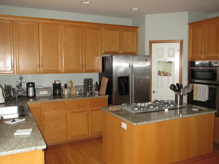 Kitchen island with cooktop, modern stainless steel applianc