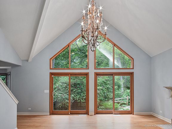 Living Room with full wall of Windows to private rear yard
