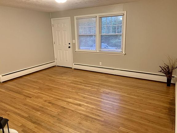 Spacious living room with hardwood floors