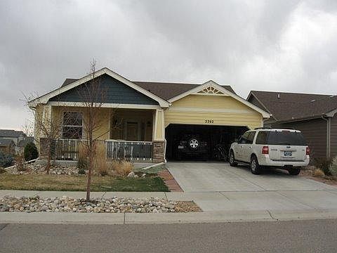 Front of house, large 2 car garage with storage. Landscape has been updated (since photo). Corner lot with lots of storage in garage.