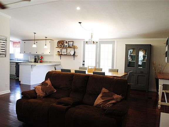 Living room looking into the dining room and kitchen. Great open floor plan for entertaining.