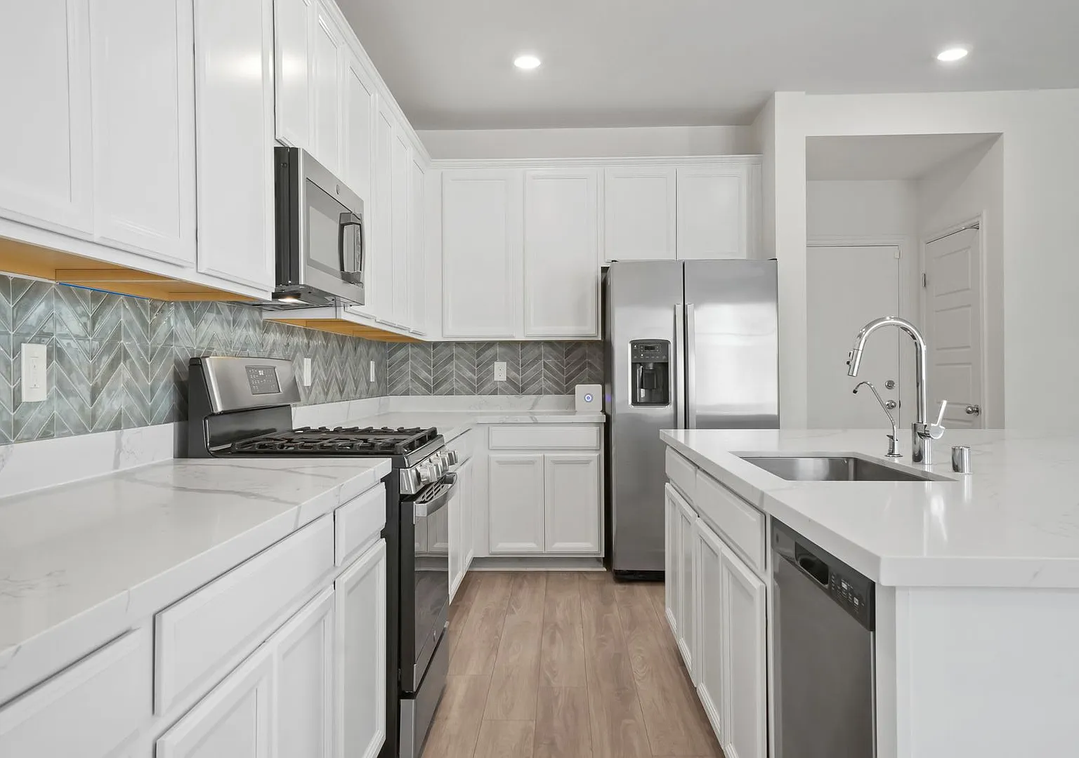 Stunning 4 Bedroom Home with Downstairs Room! — Photo 4