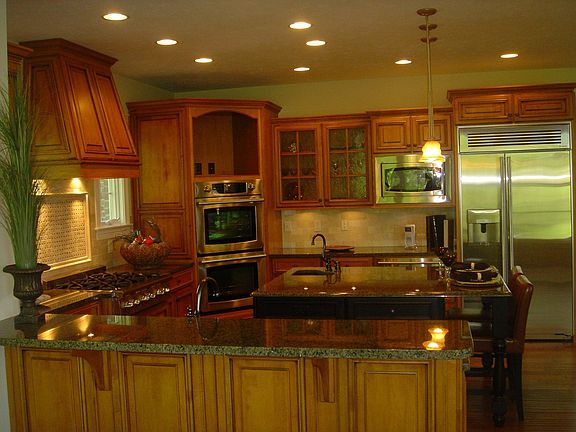 Gourmet kitchen with bench made custom cabinets in maple and cherry woods 