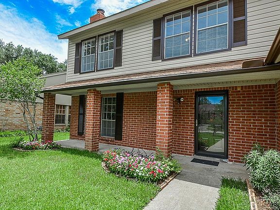 Welcome home! Imagine all the conversations and memories created on this lovely covered porch