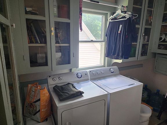 Laundry room, pantry, and storage off of kitchen. Closed room with door.