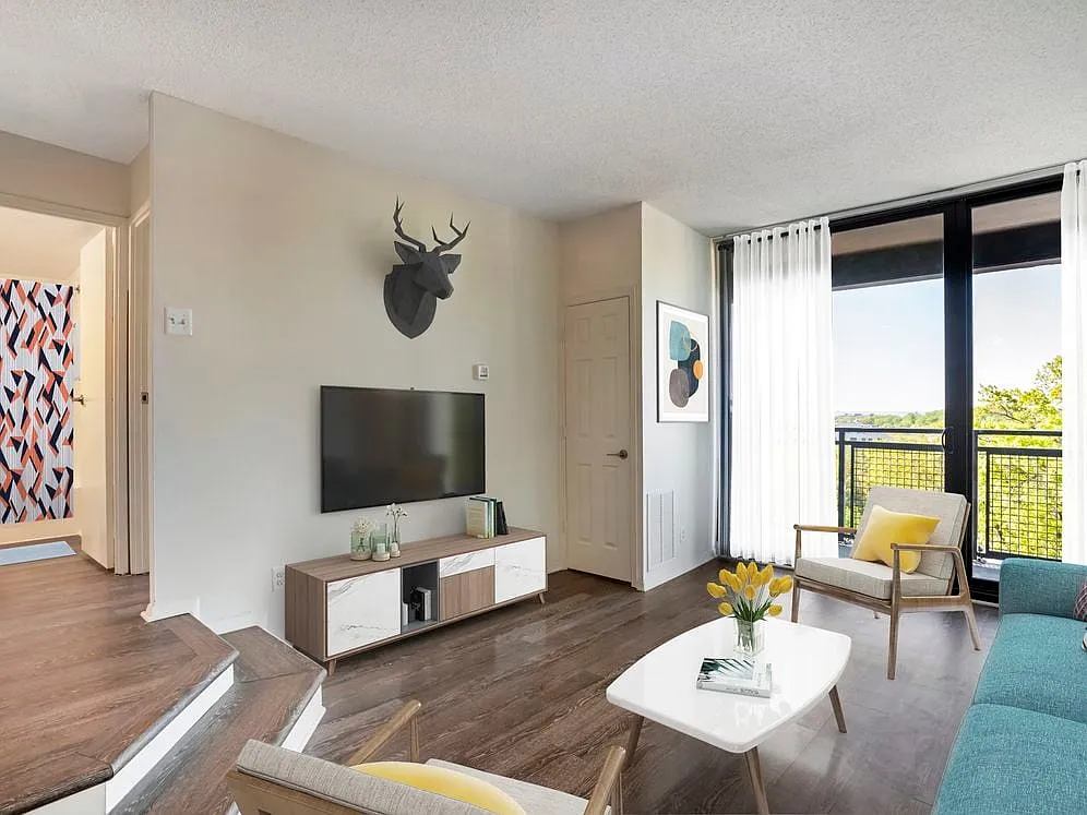 Renovated Package II living area with hard surface flooring - AVA Van Ness