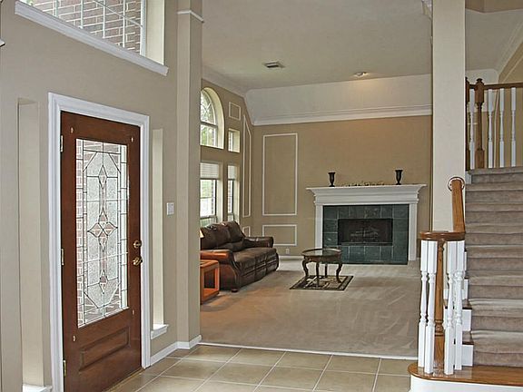 Formal Living With Fireplace and Lots of Architectural Detail. This Home has Ample Natural Light.