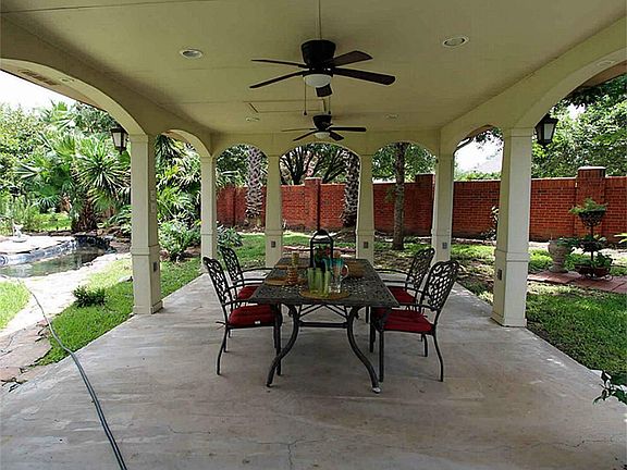 This patio is almost 500 square feet with three fans, lighting, and a cable outlet.