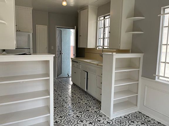 dinette area into kitchen and view of back entrance