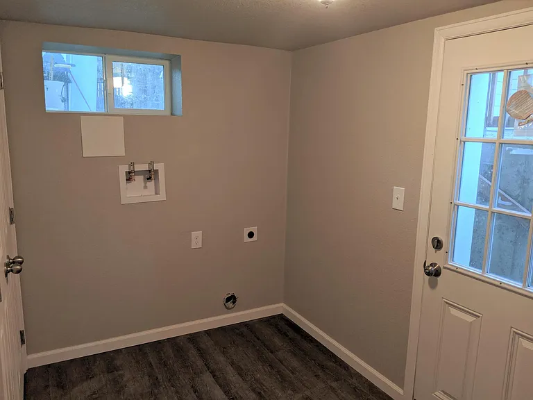 Mud room with washer / dryer (this picture was taking before the washer and dryer were installed). This w/d is exclusive to 827 and the exterior door is a second entrance and takes you to private outdoor space.