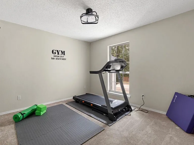 Gym on 2nd floor with treadmill and yoga area. Also has a spacious closet.