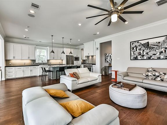 Expansive family room opens to the gourmet island kitchen. This seamless flow is perfect for simple gatherings or entertaining large groups.