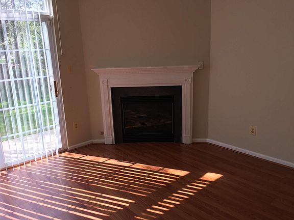 Large well lit Living Room with a fire place