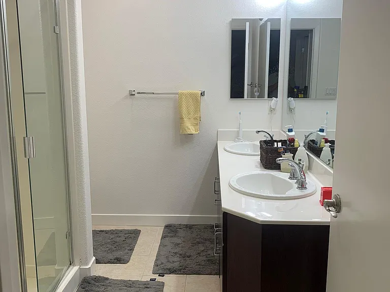 Huge bathroom in master with standing shower and two sinks