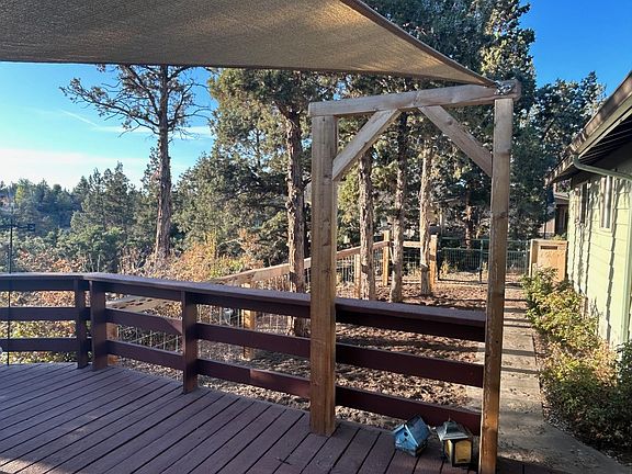 Gated deck with fenced and gated backyard/dog area.