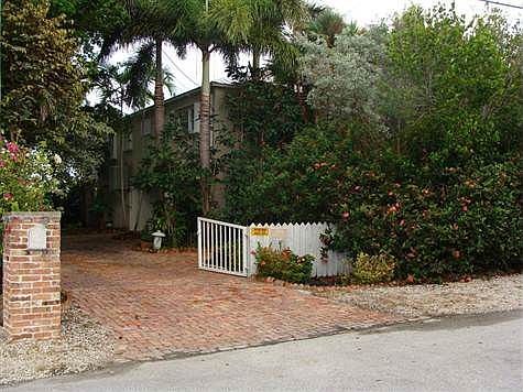 Gated and fenced and beautiful mature landscaping make this canal front home something special