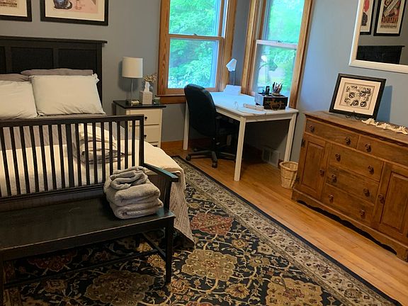 Bedroom has 2 closets & views of the woods